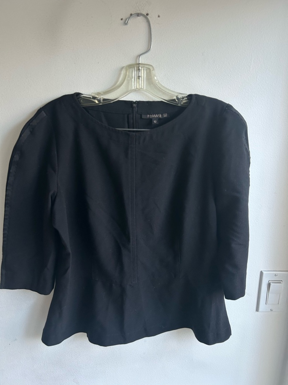 Femme peplum top with three-quarter sleeves and a round neck. Women’s large